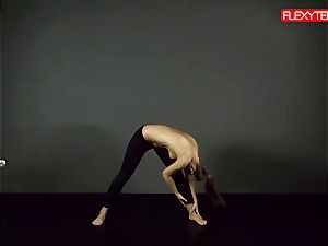 dark-haired gymnast demonstrating of her arse